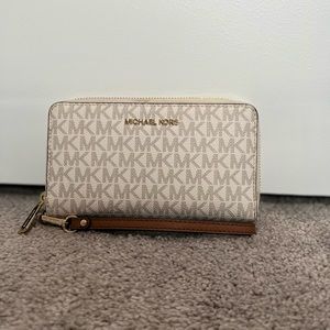 Brown and cream Michael Kors logo wallet